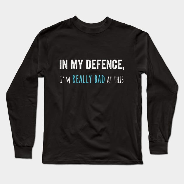 In my defence funny t-shirt (UK spelling) Long Sleeve T-Shirt by Fallacious Trump